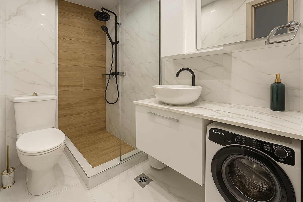 Marble-finished bathroom with walk-in shower and washing machine